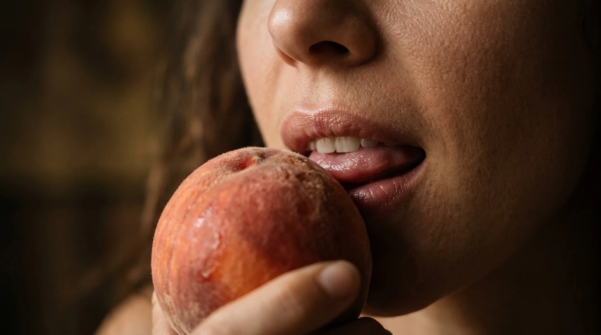 Close-up of a person gently licking a ripe peach as a metaphor for cunnilingus.